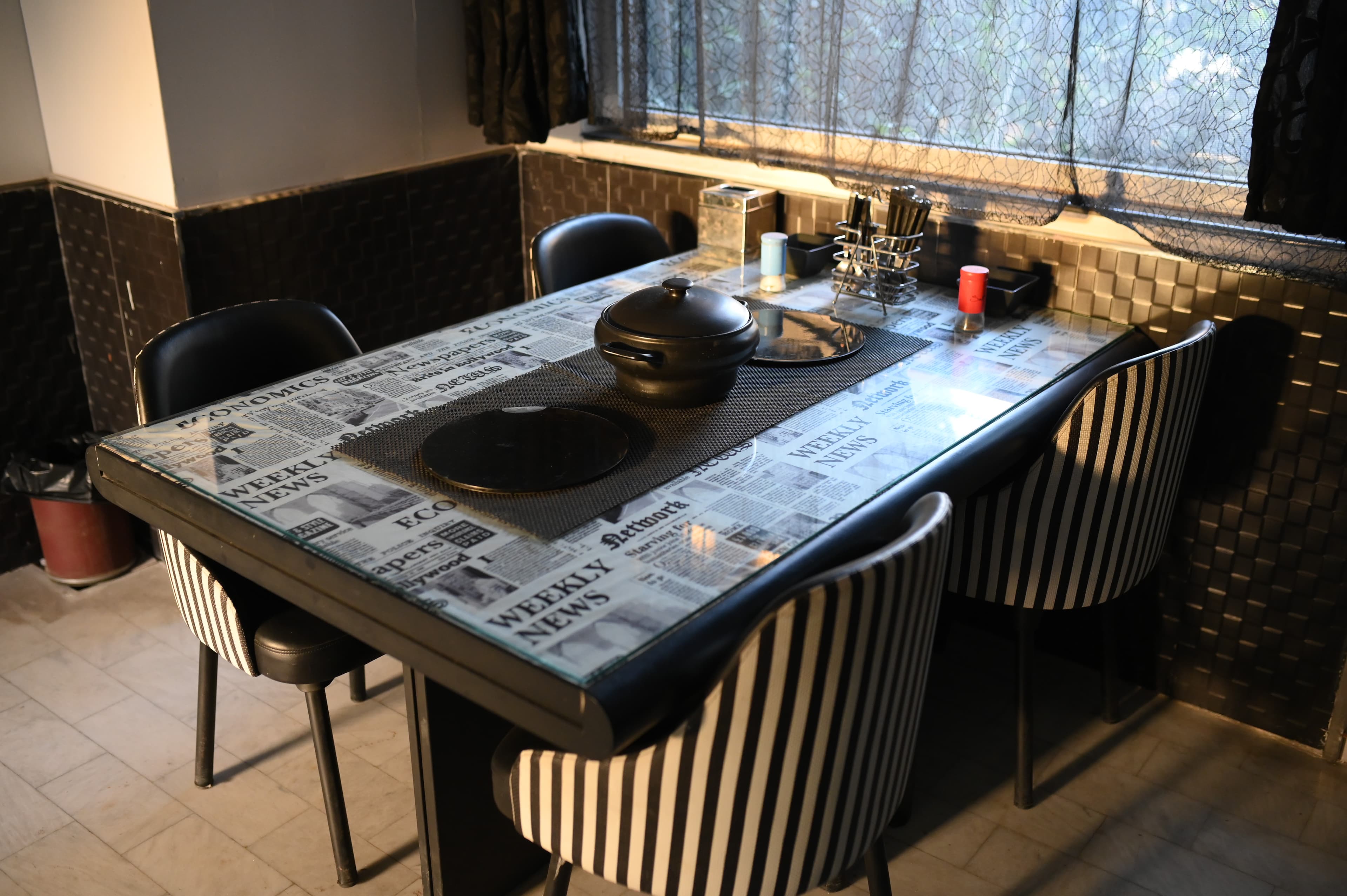 GreenLux Residency shared dining and lounge